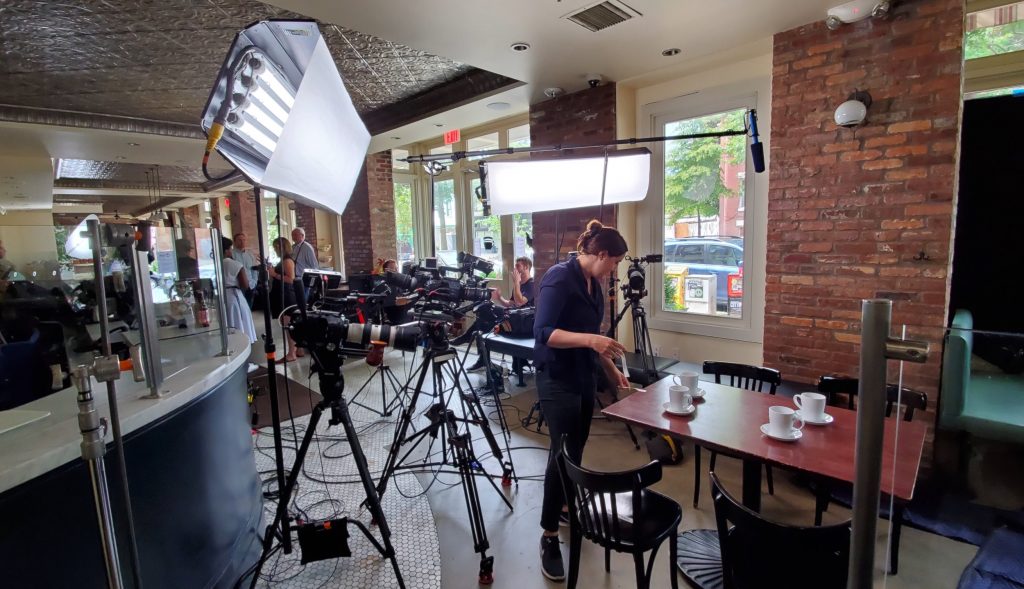 Behind the scenes image of a video shoot.
